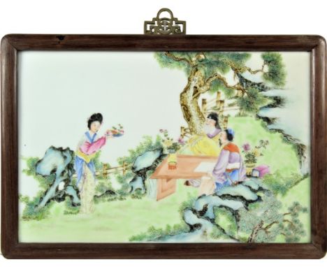 Exceptionally decorated landscapes with figures seated at a table, with fine famille rose enamels. Original frame, untouched 