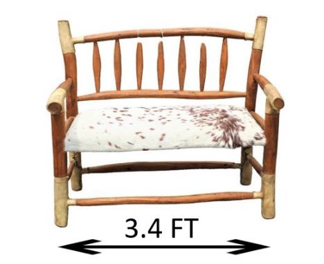 Wooden carved bench with cowhide seat and rawhide trim. Measurements: 41 x 24 x 36 1/2 in. Please note that all sales are fin