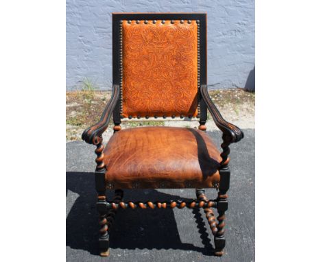 Gorgeous leather chair fit for a king! Patterned leather, cowhide, nailhead trim, carved wood. King Ranch Saddle Shop. Measur
