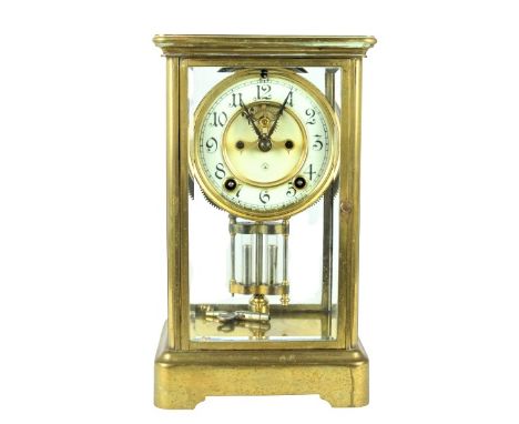 American mantle clock by the Ansonia Clock Co., circa 1900. Brass-plated case with beveled glass sides and door. White enamel