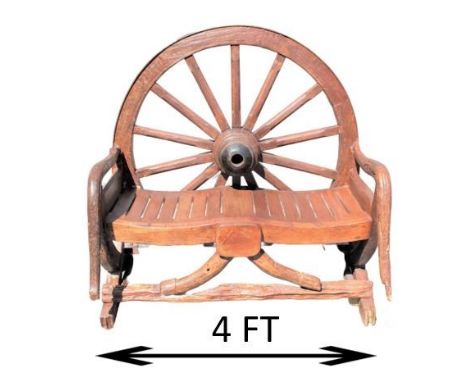 Rustic bench made from antique wagon wheel and reclaimed barn wood. Measurements: 50 x 48 x 34 in deep. Please note that all 