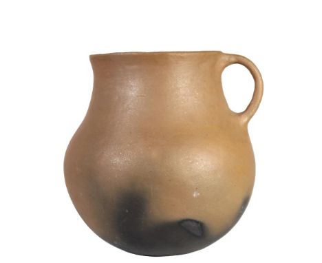 Water jar with handle, micaceous ware with fire clouds. Fire clouds are irregular discolorations on the exterior of the potte