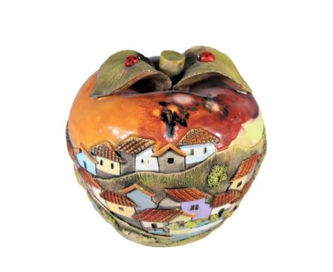 Fired ceramic in shape of apple, with hand-painted embellishments of a hillside village, Ecuador. Height : 5 1/2 in. Please n