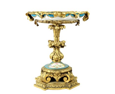 Two pieces. Dish separates from the stand. Adorned with cherubs and flowers. Size: 13 x 9 x 14 in. Please note that all sales