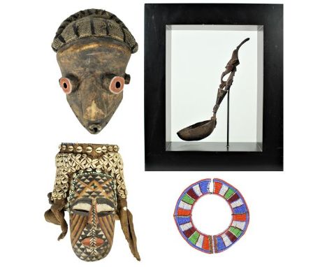 Group consisting of 2 masks, a carved wood spoon and a beaded necklace. Sizes: Mask: 12 1/2 x 8 in. Spoon: 15 1/2 x 5 x 18 1/