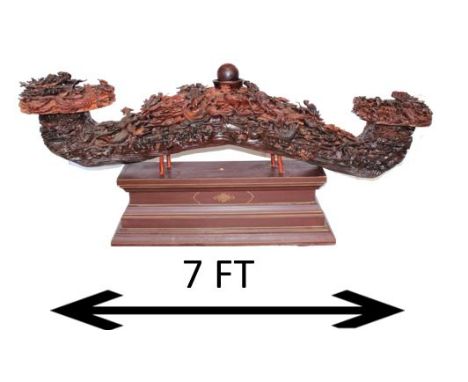 Intricately carved rosewood, monumental in size and majesty. On base. Dimensions: 86 in x 19 x 37 1/2 in. Please note that al