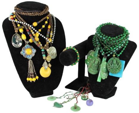 Various sizes and colors. Includes green beaded necklaces with large pendants, yellow and brown beaded necklaces with stone p