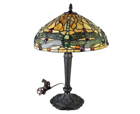 Stained glass Tiffany style table lamp with dragonfly motif; bronze base. Single bulb socket. Approximately 20 inches tall. P