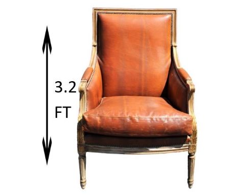 Leather arm chair with nailhead trim, carved wood. Measurements: 25 3/4 x 29 x 38 1/2 in. Please note that all sales are fina