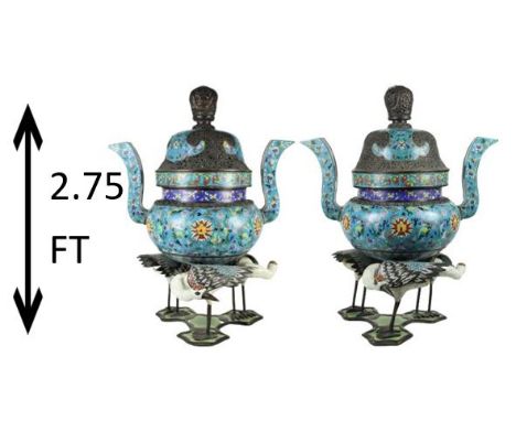 This pair of Monumental Chinese Cloisonne Censors is supported on three figural cloisonne Crane form legs. The body of each c