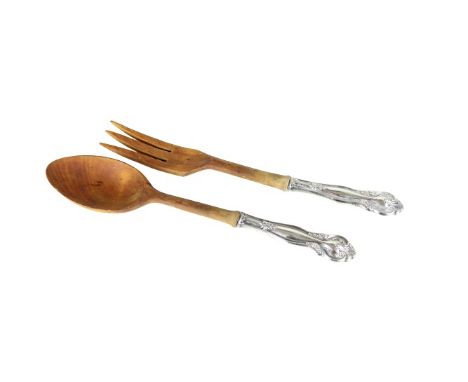 Sterling 1.25 OZT, hand-carved fork and spoon. Approx. 8 in.