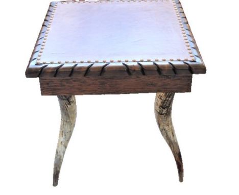 Southwestern end table with leather top and horn legs. Measurements: 24 x 24 x 24 in. Please note that all sales are final an