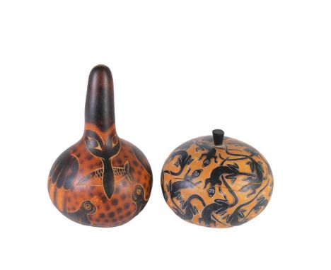 Two decorative gourds, one appears to be a rattle, Larger is signed by famous Peruvian Guard Artist, Evaristo Medina. The oth