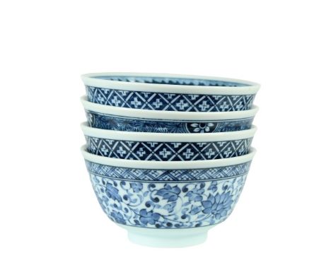 Four Chinese rice bowls, beautiful blue and white floral motifs.  Approx 3 in tall. Please note that all sales are final and 