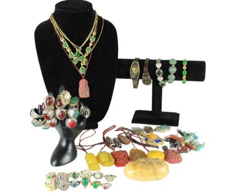 Great collection of Costume Chinese Jewelry which includes 26 rings, 31 pendants, 3 ceramic beads, 5 bracelets, 3 necklaces a