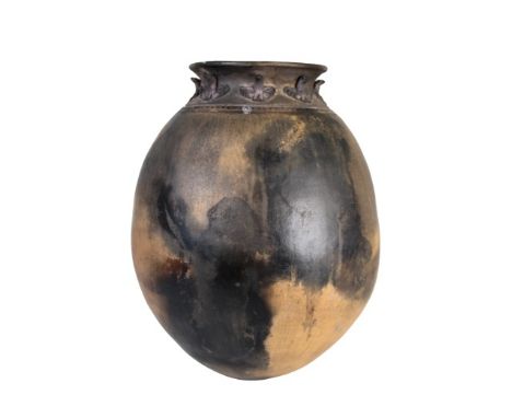 Large water jar, fired clay with numerous fire clouds. Raised animal motif and incised decoration along rim. Measures: 11 1/2