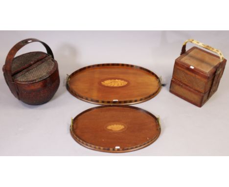 Two 19th century mahogany oval two-handled tea trays each with inlaid shell motif to centre, 68cm x 43cm &amp; 54cm x 36cm; &