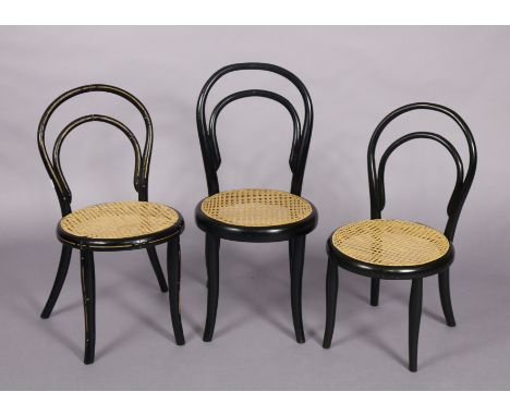 A late 19th century Thonet ebonised child’s chair with gold painted decoration &amp; initials, with cane circular seat, a sim