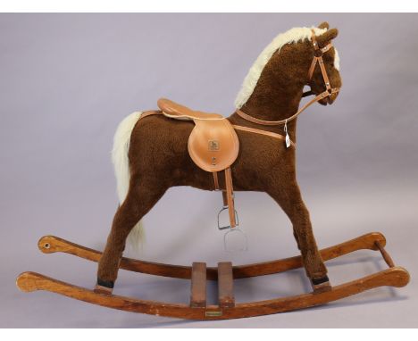 A Mamas &amp; Papa’s fabric-covered rocking horse on a pine base, 110cm (slight faults). 