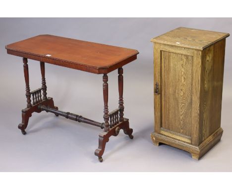 A Victorian mahogany centre table with canted corners &amp; moulded edge to the rectangular top, &amp; on a pair of turned su