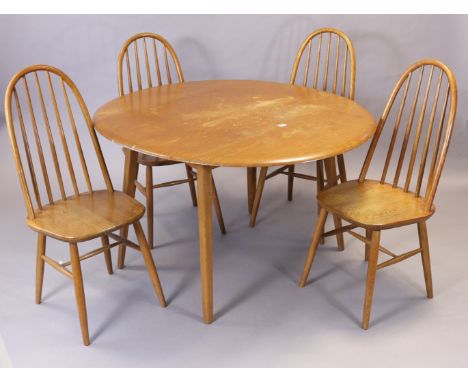 A set of four spindle back dining chairs with hard seats, &amp; on round tapered legs with spindle stretchers, &amp; a ditto 