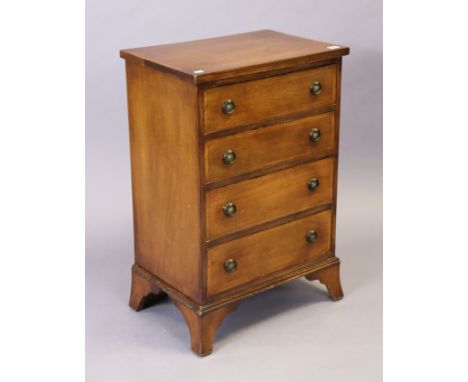A mahogany-crossbanded small chest fitted four long graduated drawers with brass ring handles, &amp; on bracket feet, 50.75cm