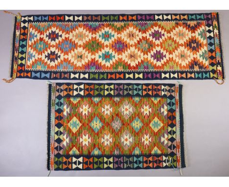 A Kilim corridor runner of multi-coloured geometric design, 197cm x 63cm; &amp; a similar rug, 121cm x 77cm. 