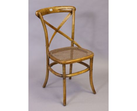 An Oka “Camargue” single chair with a woven cane seat, &amp; on round legs. 