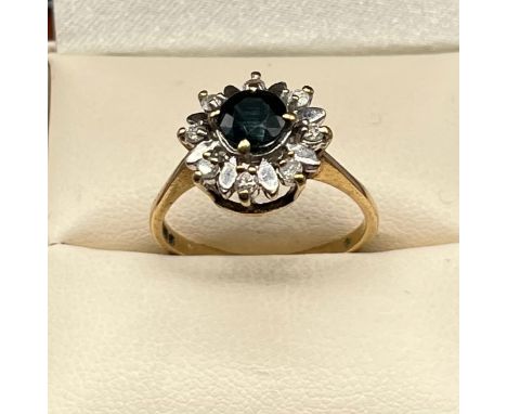 9ct yellow gold Sapphire and diamond stone ring. [Sapphire round cut 5.67mm diameter] [Ring size P] [2.85Grams] 