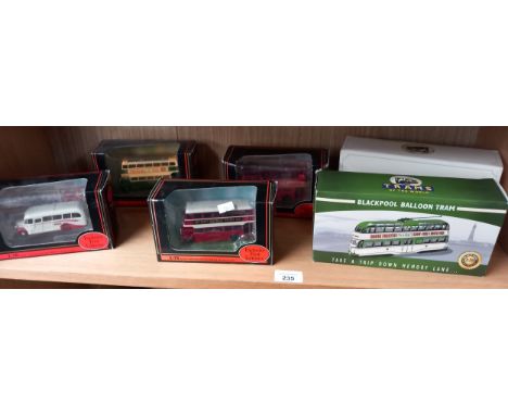 A Collection of four Boxed Exclusive First Editions Buses, with two tram figures. 