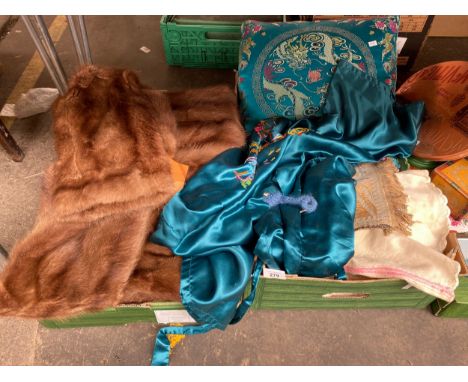 Two crates of textiles; Silk oriental night dress/ gown, Dragon designed silk pillow, Fur coat and many more items 