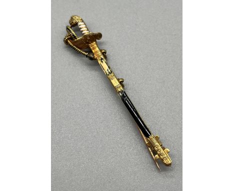A 14ct yellow gold and enamel Royal Naval officers Sword Brooch. [6cm in length] [5.15grams] [Enamel damaged- see images]