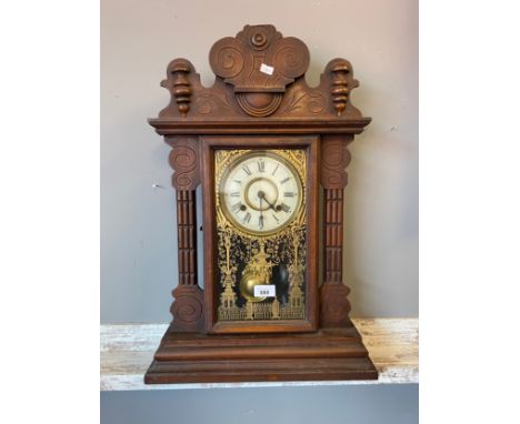 American Gingerbread clock made in the U.S.A  Comes with key and pendulum. 