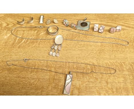 A Selection of silver and mother of pearl jewellery; Ring, various earrings, pendants and silver chains. Includes sets. 