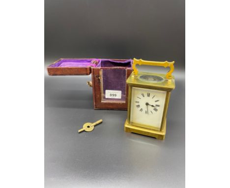 Antique brass carriage clock with travel case and key. In a working condition. 