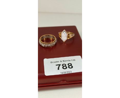 Two 9ct yellow gold ring; Ring fitted with a carved cameo- [Ring size P] The other a 9ct yellow gold band fitted with quartz 