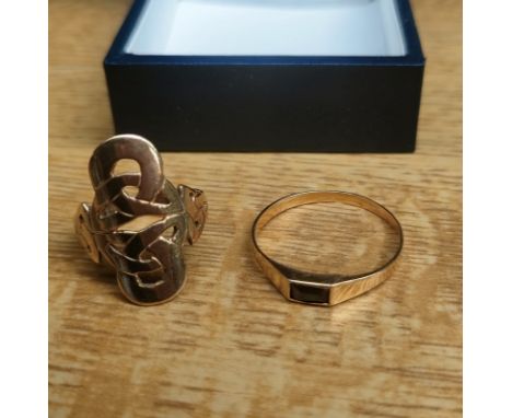 Two yellow gold rings; 9ct gold Celtic design ring- [Ring size I] [2.96grams] &amp; high grade gold 18ct ring set with a blac