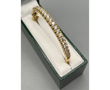 Heavy 18ct yellow gold ladies bangle set with varying sized clear stones [Not diamonds] [20.39grams] [Tested positive for 18c