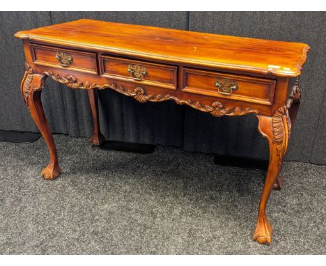 Antique style console table, the shaped surface, above three short drawers, raised on cabriole legs ending in claw and ball f