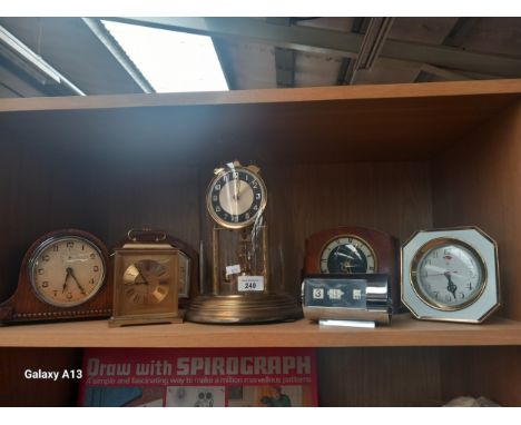 A lot of Seven Clocks to include Dome Glass mantle Clock with German Movement, most is working condition. 