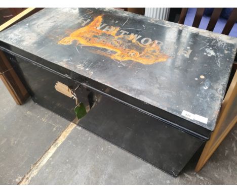 A large military style metal travel trunk with key. 