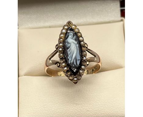 Antique Chester 9ct yellow gold ring; set with a black carved cameo surrounded by seed pearls. [Missing 7 seed pearls] [Ring 
