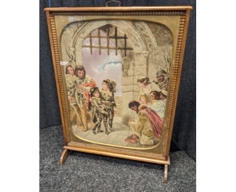 Antique Fire screen fitted with a tapestry with hand painted faces, fitted within a mahogany frame. 
