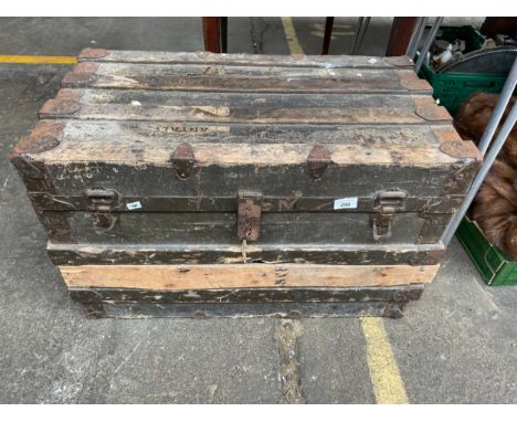 Antique wooden bound travel trunk. 