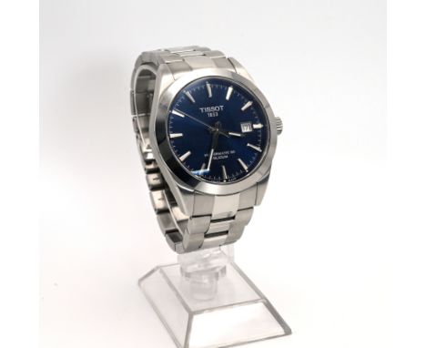 A boxed Tissot Powermatic 80 Silicium watch, the blue dial with baton hour markers and date aperture in a stainless steel cas