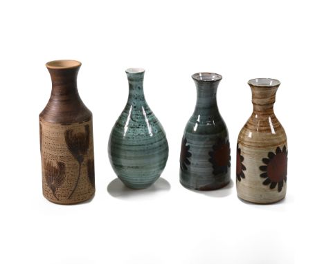 A selection of four 20th Century pottery from the Briglin Studio including a mallet shaped vase brush glazed with a sunflower