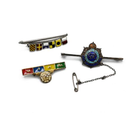 A Naval signalling flags brooch, stamped &rsquo;Silver&rsquo;; a silver and enamel sweetheart brooch; and a silver gilt and e