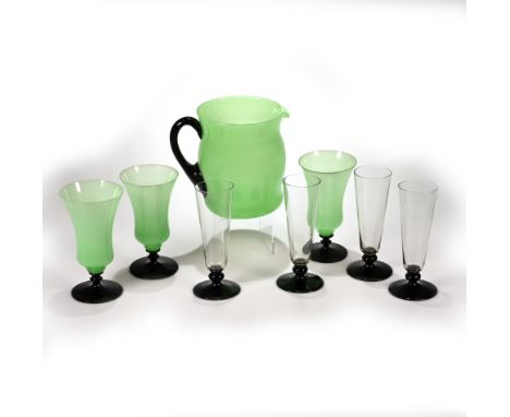 Two 1930's Art Deco sets of glasses. The first a set of four short stemmed champagne flutes with clear glass conical bowls su