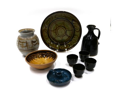 A quantity of Cricklade pottery, to include a green ground platter 31cm wide, a mead set of 4 cups and jug in dark green, jug