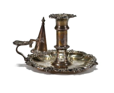 A George IV silver chamber stick, by S C Younge &amp; Co, Sheffield 1824, with leaf and scroll borders, ejecting mechanism fo